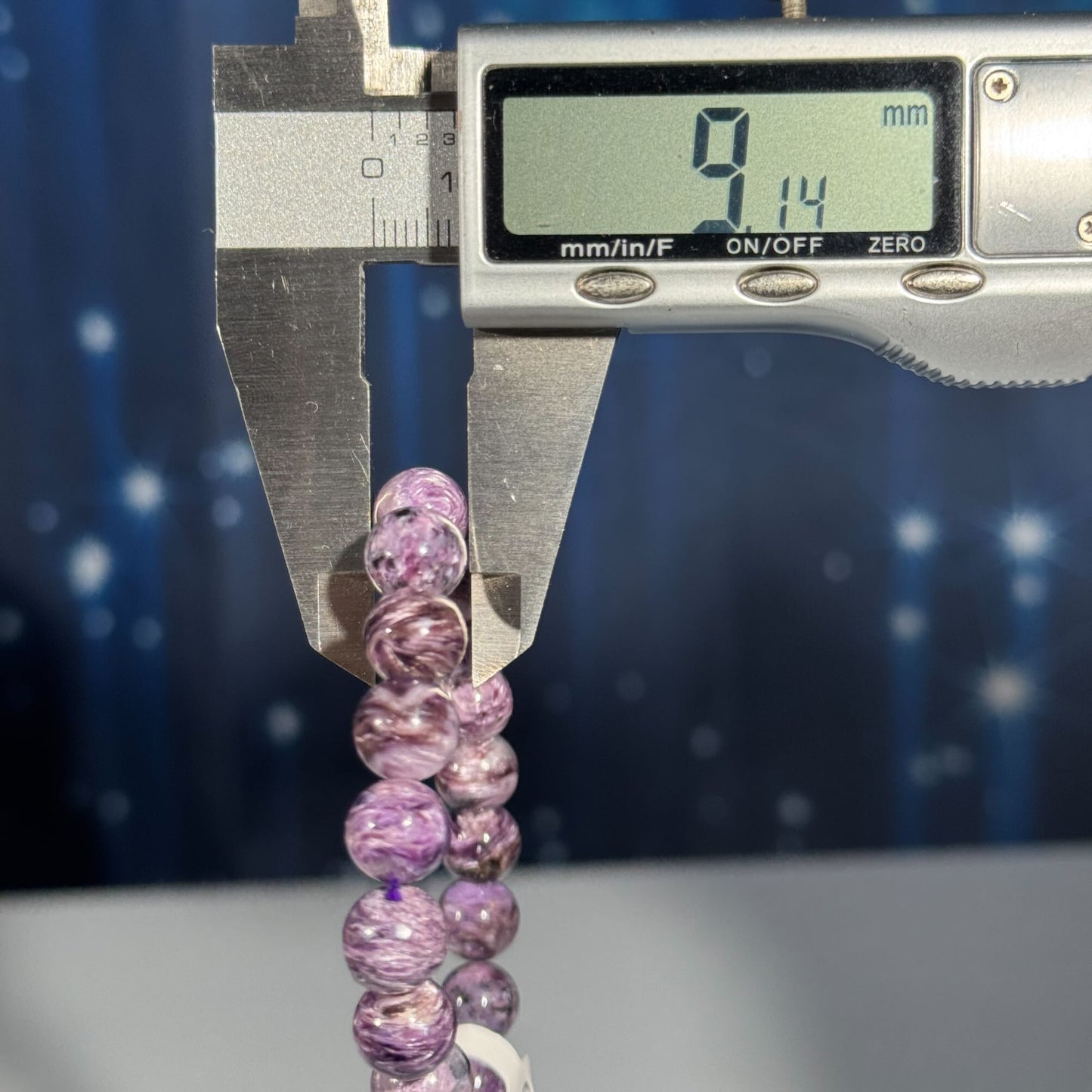 One (1) charoite bracelet - 9mm beads, fits 6.25" wrist - flashy