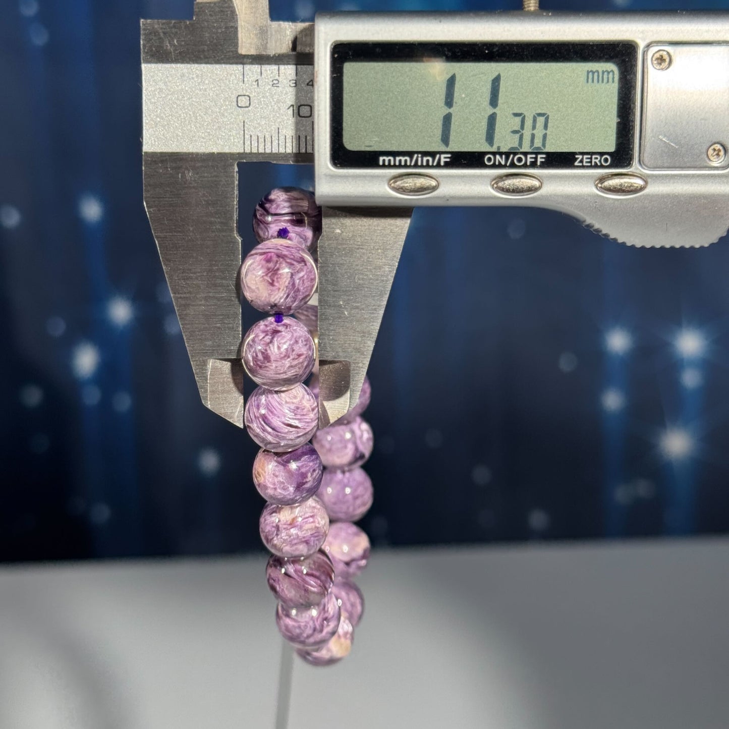 One (1) Charoite bracelet - 11mm beads, fits 6.5" wrist - flashy