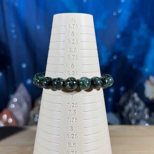 One (1) Seraphinite bracelet - 10mm beads - fits 6.5" wrist - flashy