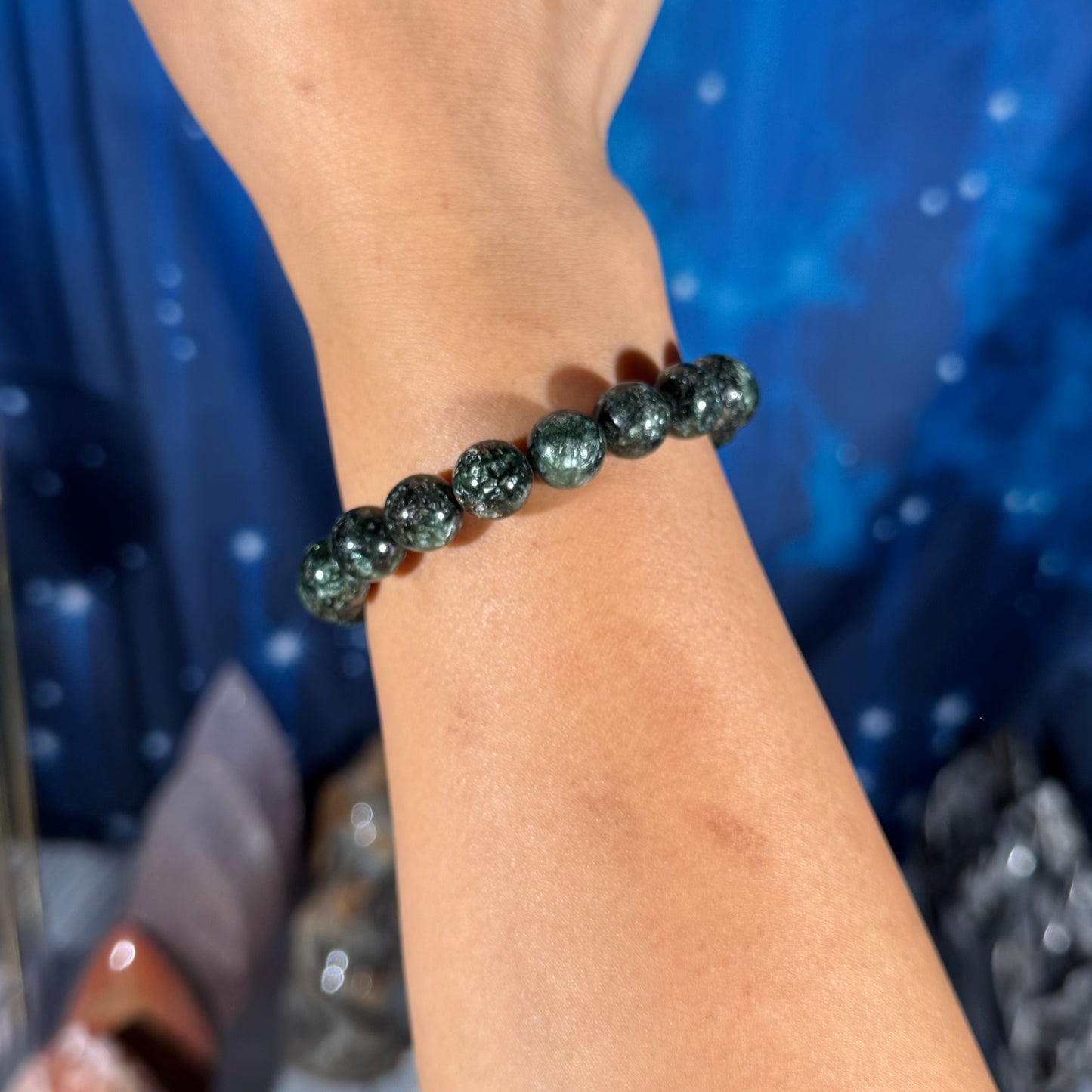 One (1) Seraphinite bracelet - 10mm beads - fits 6.5" wrist - flashy