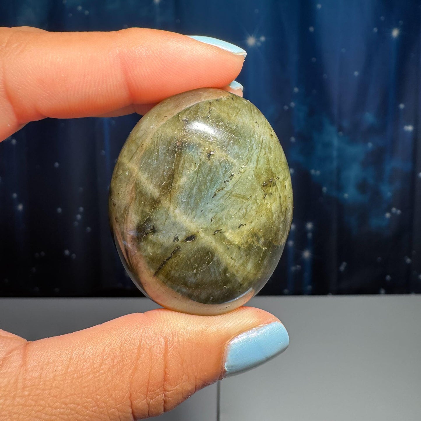 Labradorite palm stone | 1 7/8ā long | 76 grams | blue flash | yellow flash | silver flash | orange flash