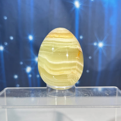 Green banded calcite egg - 2" × 2" × 2 5/8" - 8.8 oz