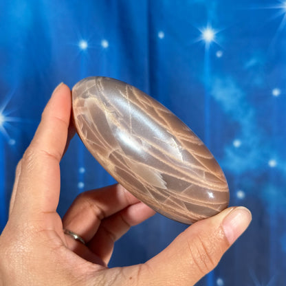 Peach moonstone with sunstone lingam - 4" × 1 3/4" × 1 3/4" - 9.9 oz