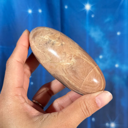 Peach moonstone with sunstone lingam - 4" × 1 3/4" × 1 3/4" - 9.9 oz