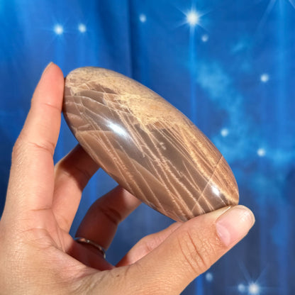 Peach moonstone with sunstone lingam - 4" × 1 3/4" × 1 3/4" - 9.9 oz