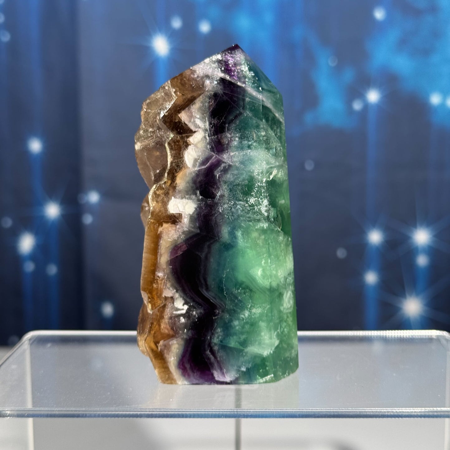 Rainbow Fluorite point with raw half