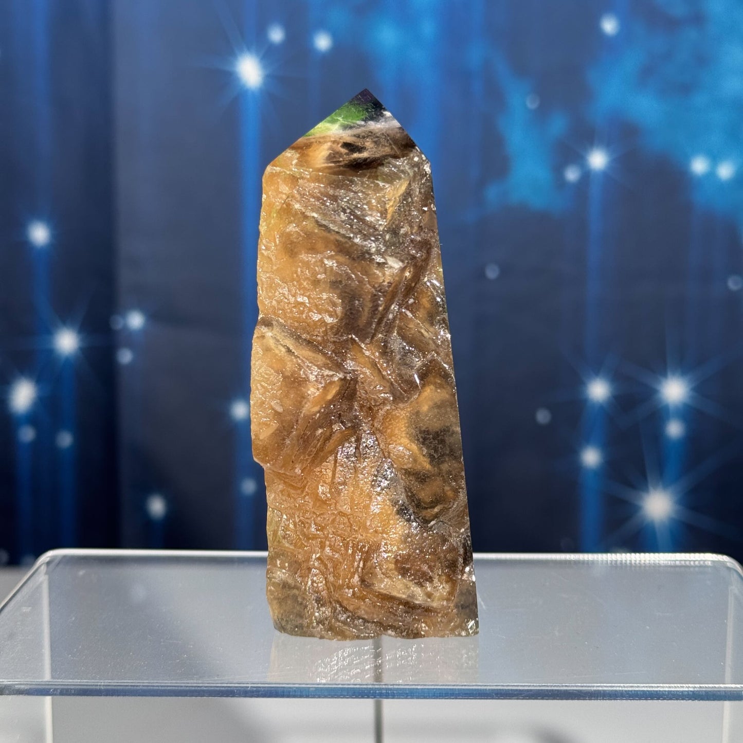 Rainbow Fluorite point with raw half
