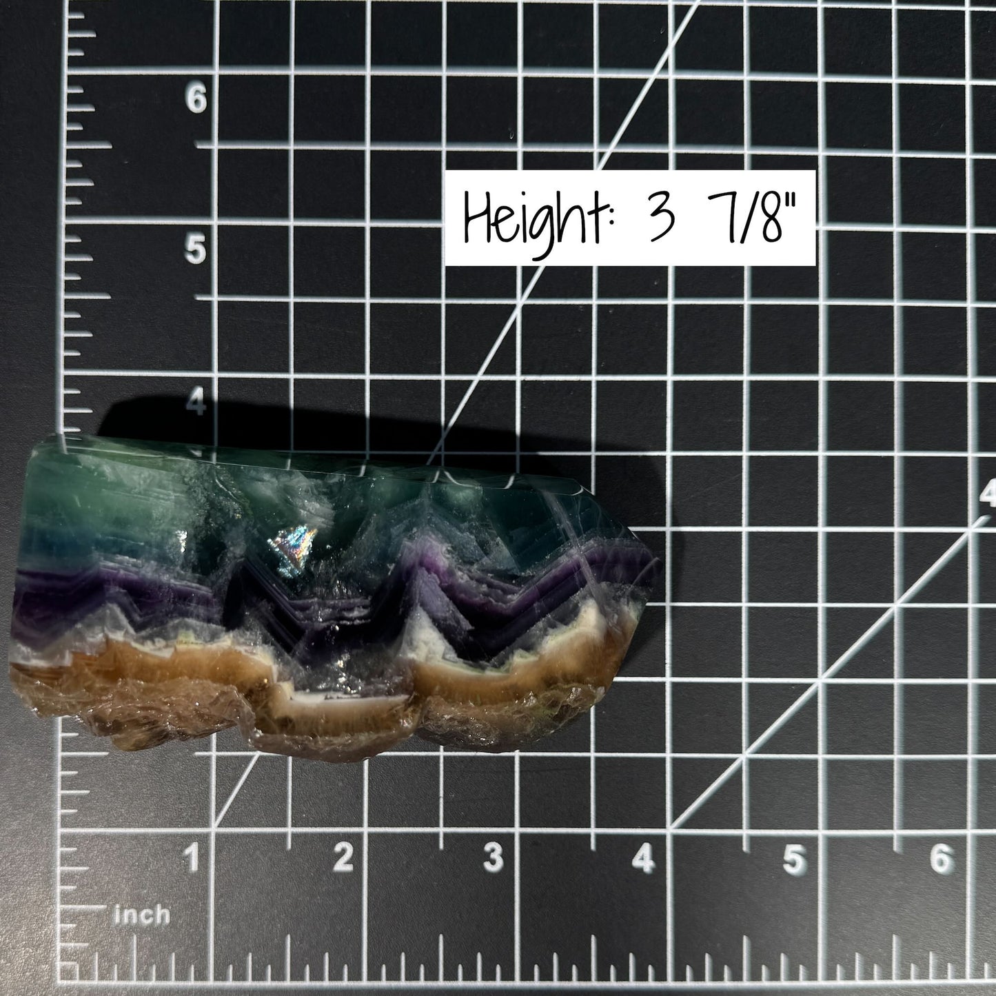 Rainbow Fluorite point with raw half