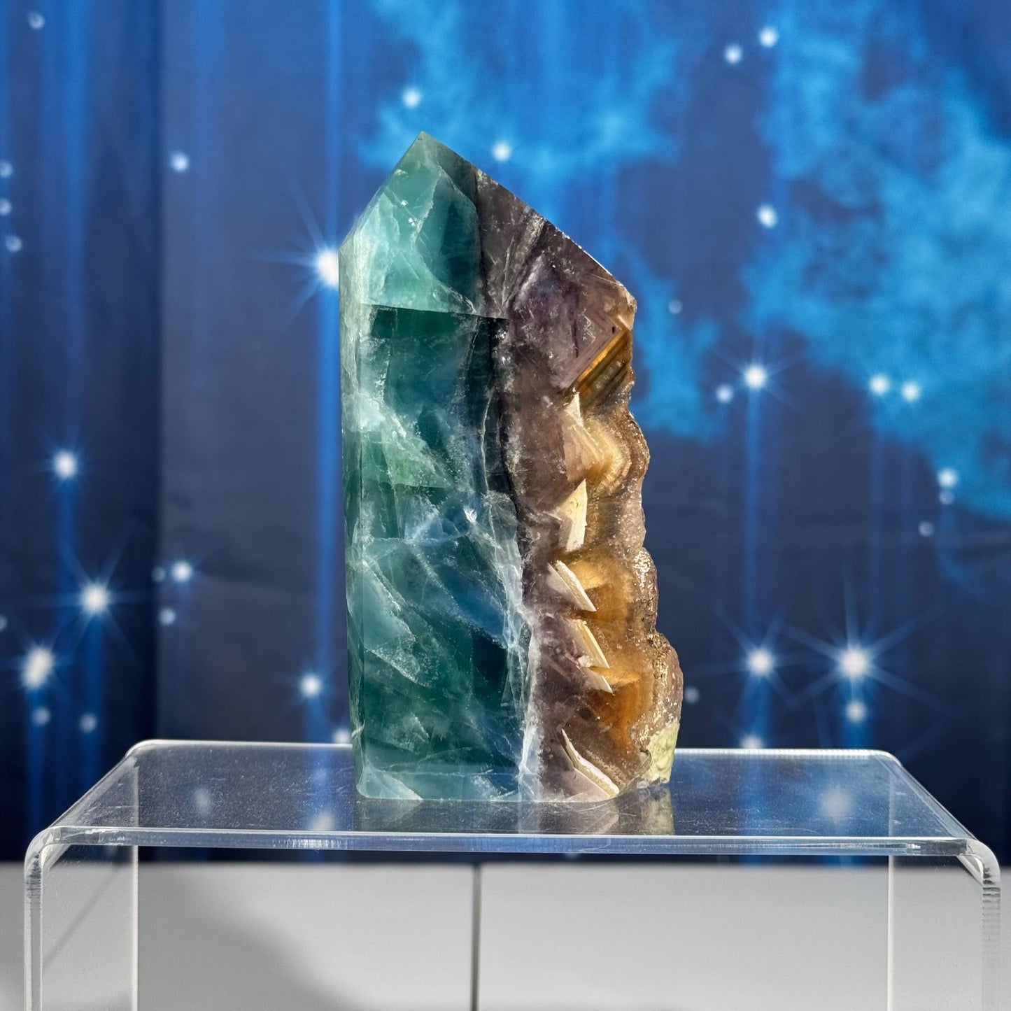 Rainbow Fluorite point with raw half
