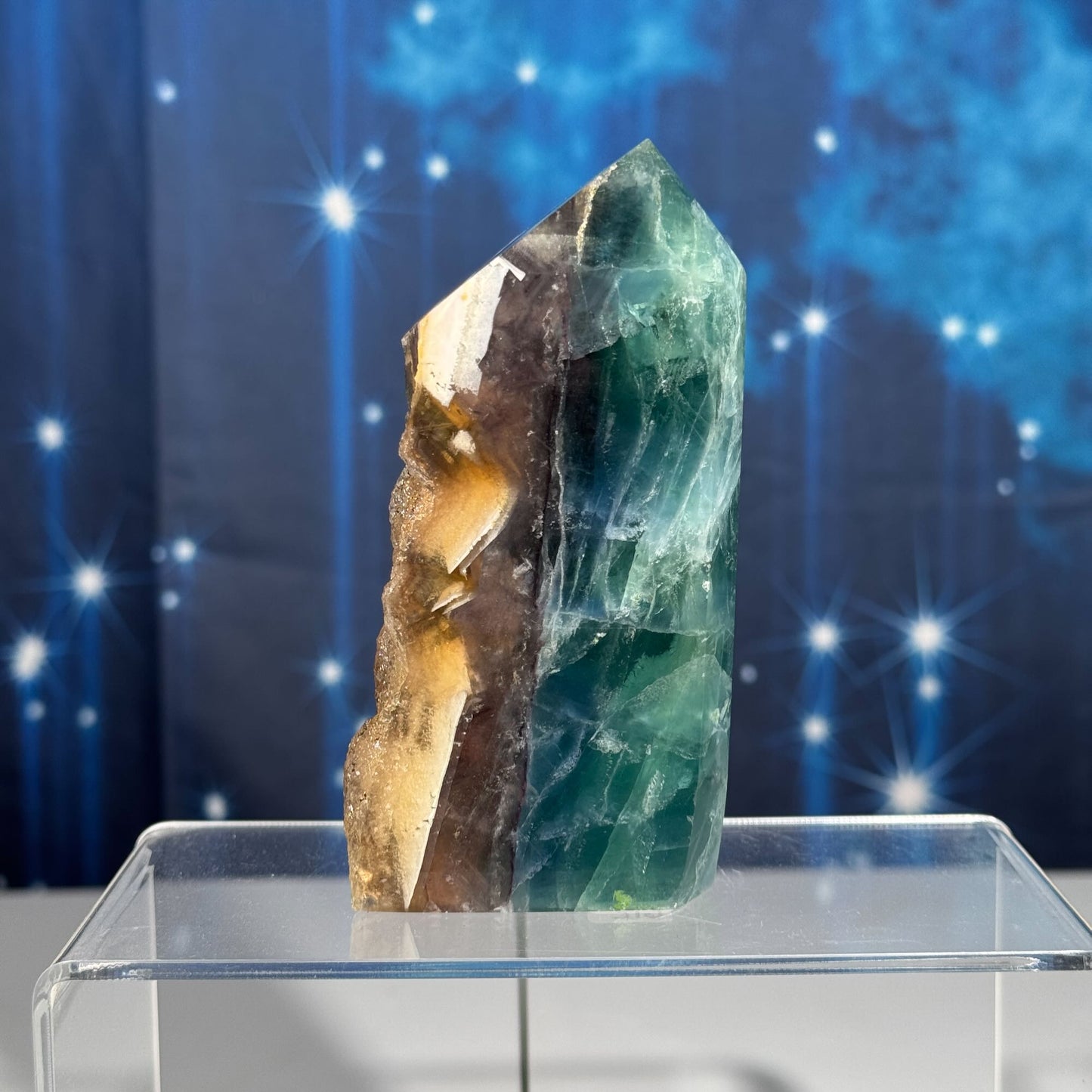 Rainbow Fluorite point with raw half