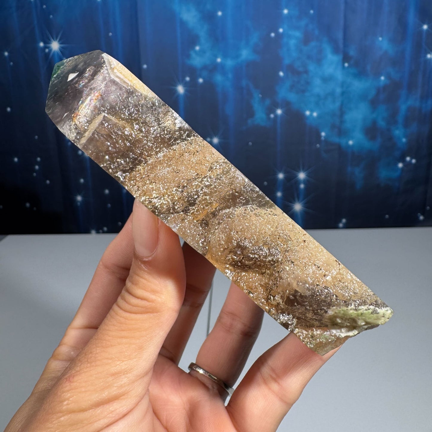 Rainbow Fluorite point with raw half