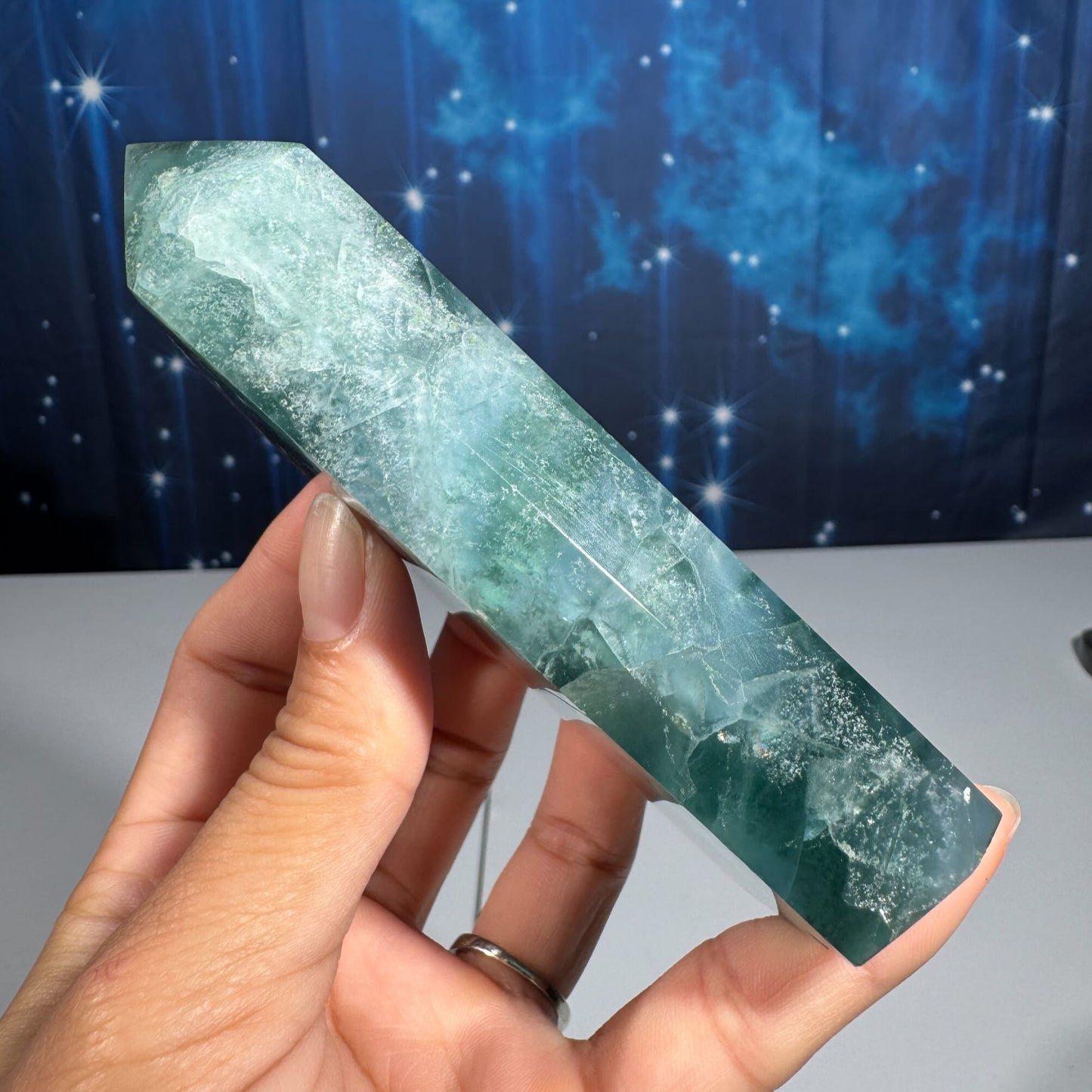 Rainbow Fluorite point with raw half