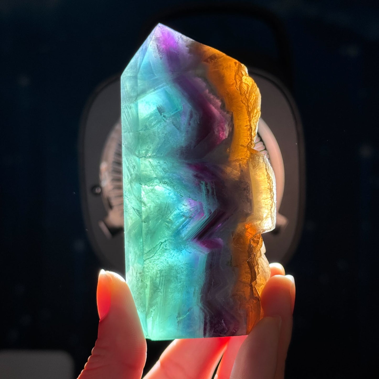 Rainbow Fluorite point with raw half