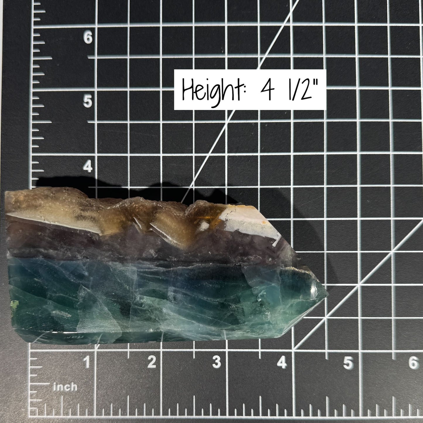 Rainbow Fluorite point with raw half