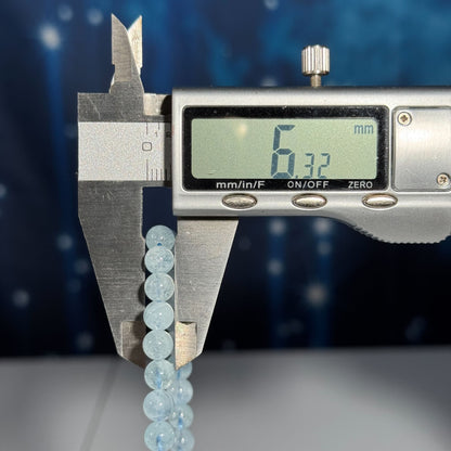 One (1) Aquamarine bracelet - 6mm beads, fits 6.25" wrist