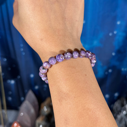 One (1) charoite bracelet - 8mm beads, fits 6.25" wrist - flashy