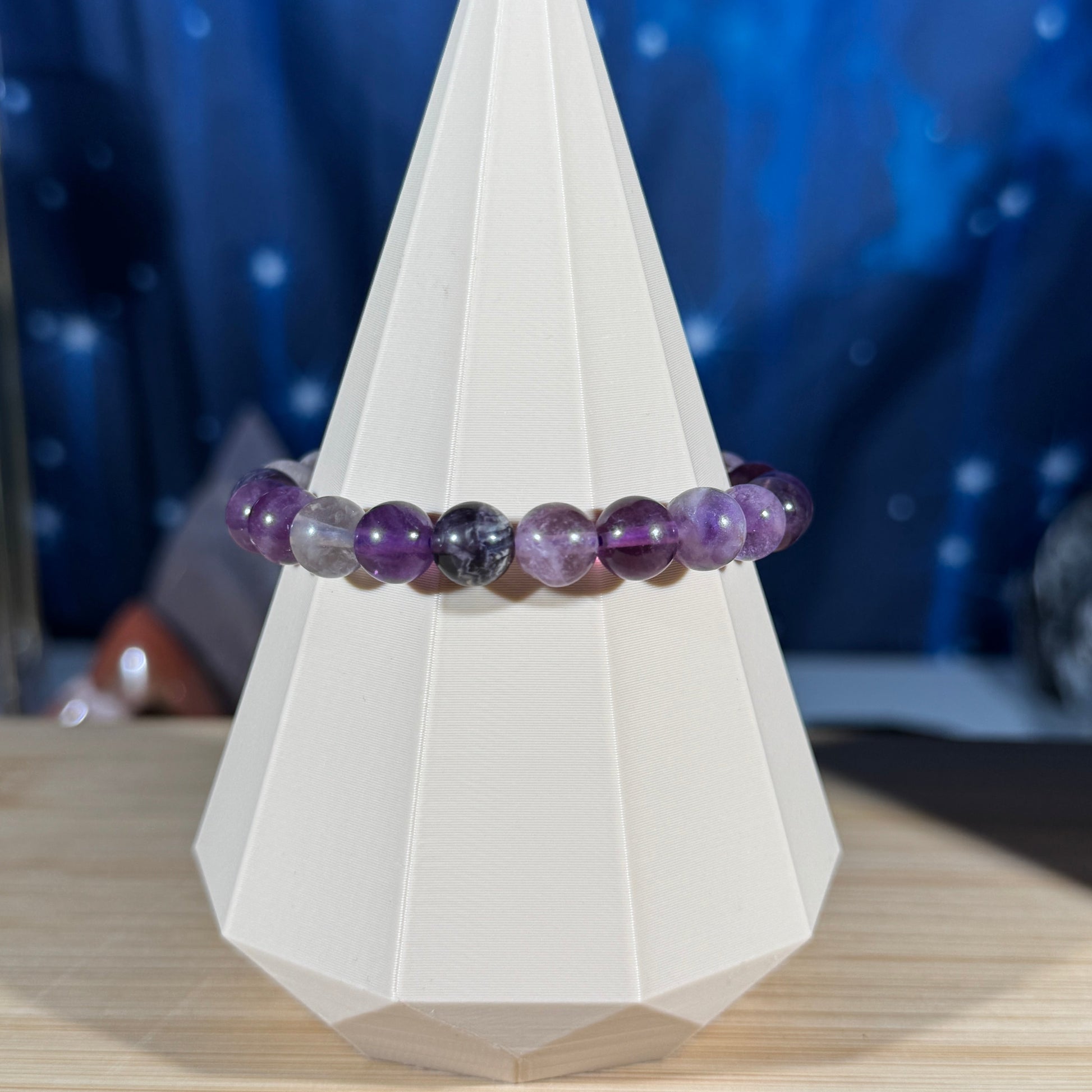 Rainbow fluorite bracelet with different shades of purple and greens
