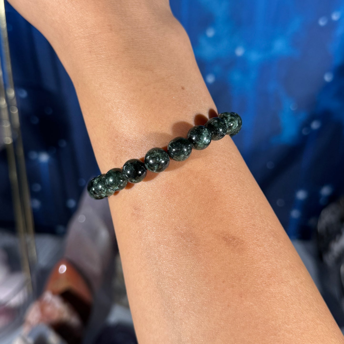 One (1) Seraphinite bracelet - 9mm beads - fits 6.75" wrist - flashy