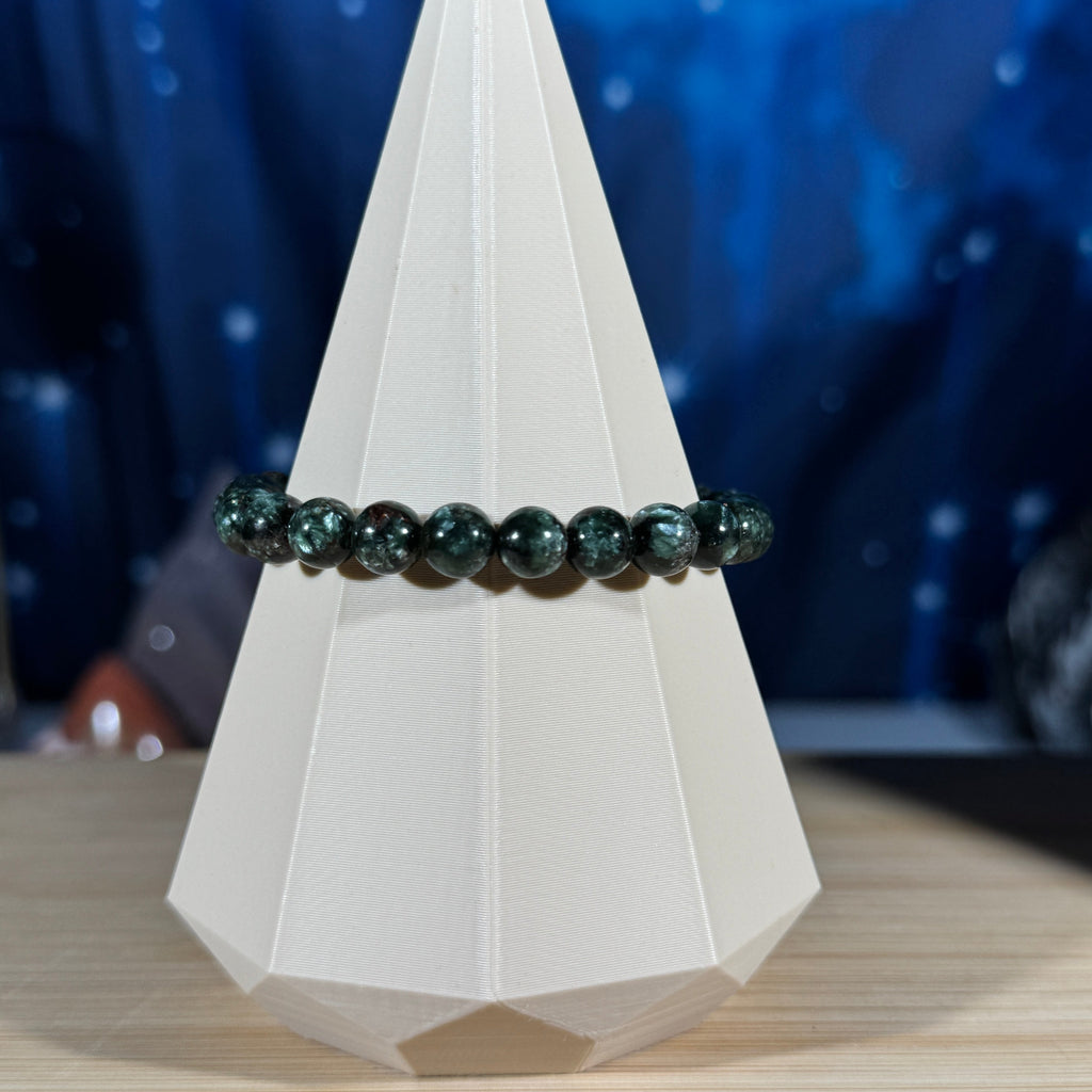 One (1) Seraphinite bracelet - 7mm beads - fits 6.5" wrist - flashy