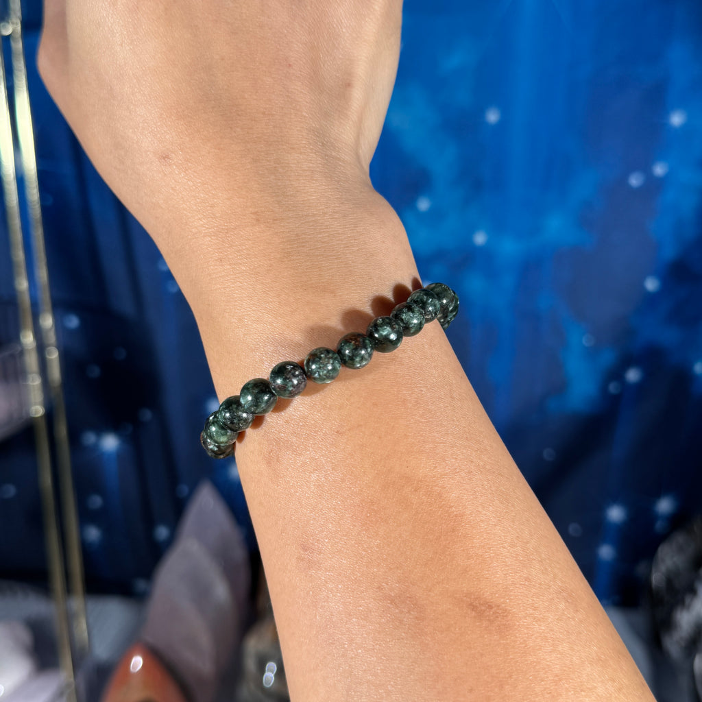 One (1) Seraphinite bracelet - 7mm beads - fits 6.5" wrist - flashy