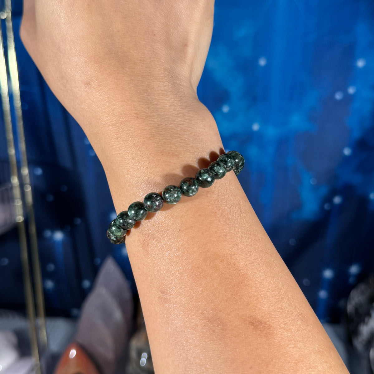 One (1) Seraphinite bracelet - 7mm beads - fits 6.5" wrist - flashy