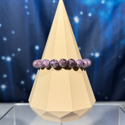 One (1) charoite bracelet - 9mm beads, fits 6.25" wrist - flashy
