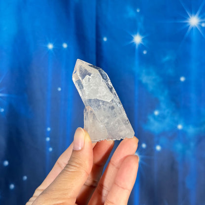Clear quartz natural point - 2 3/4" × 1 1/2" × 1 1/4" - 2.4 oz - with rider crystal