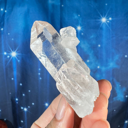 Clear quartz natural point - 2 3/4" × 1 1/2" × 1 1/4" - 2.4 oz - with rider crystal