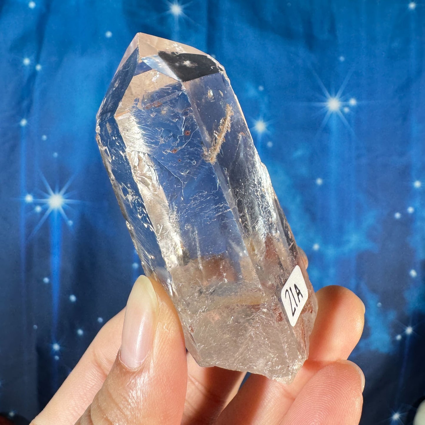 Clear quartz natural point with hematite inclusions - 1 3/8" × 1 1/8" × 3" - 3.6 oz - self-healed base