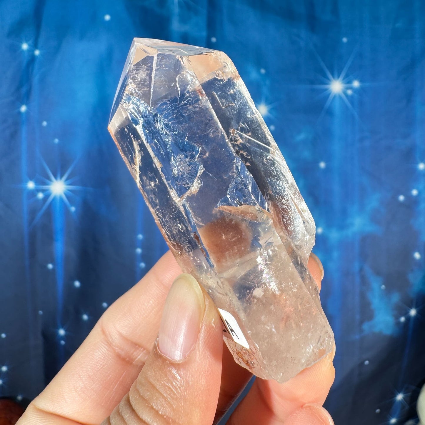 Clear quartz natural point with hematite inclusions - 1 3/8" × 1 1/8" × 3" - 3.6 oz - self-healed base