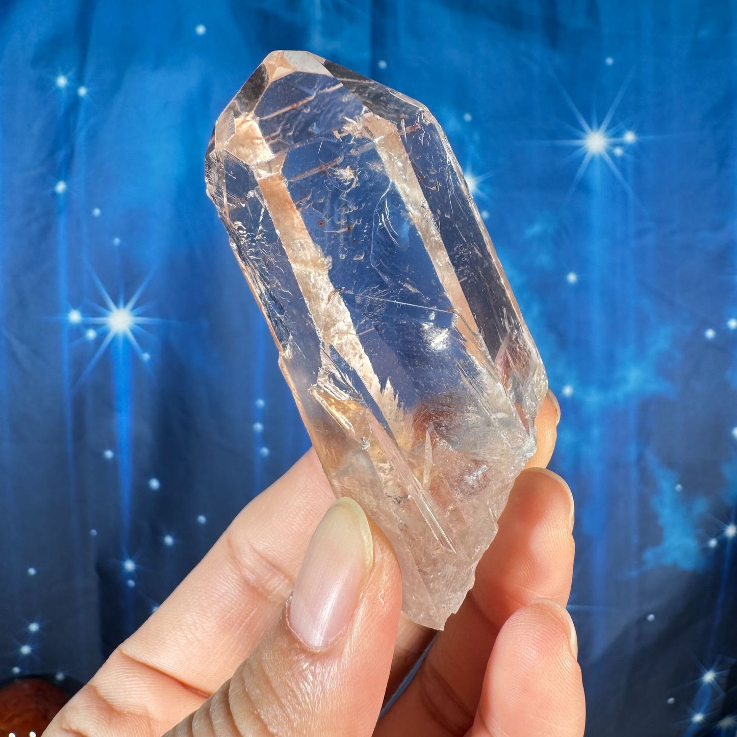 Clear quartz natural point with hematite inclusions - 1 3/8" × 1 1/8" × 3" - 3.6 oz - self-healed base