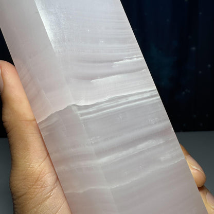 XL pink Mangano Calcite tower | 9 5/8” tall | 1.443 kilograms | Damage Discount | UV reactive | pink Banded Calcite tower