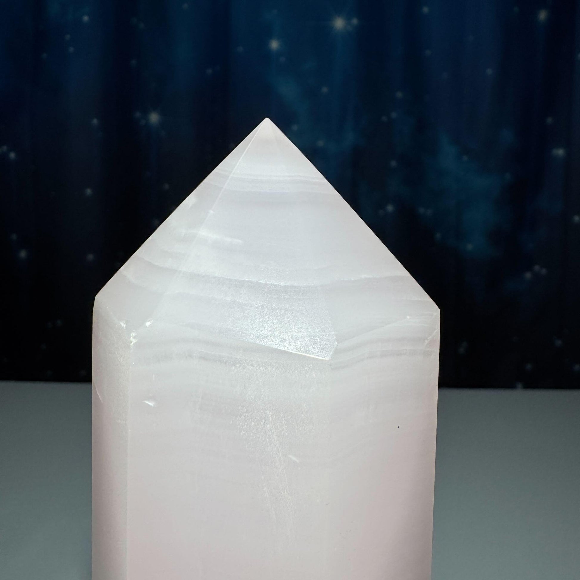 XL pink Mangano Calcite tower | 9 5/8” tall | 1.443 kilograms | Damage Discount | UV reactive | pink Banded Calcite tower