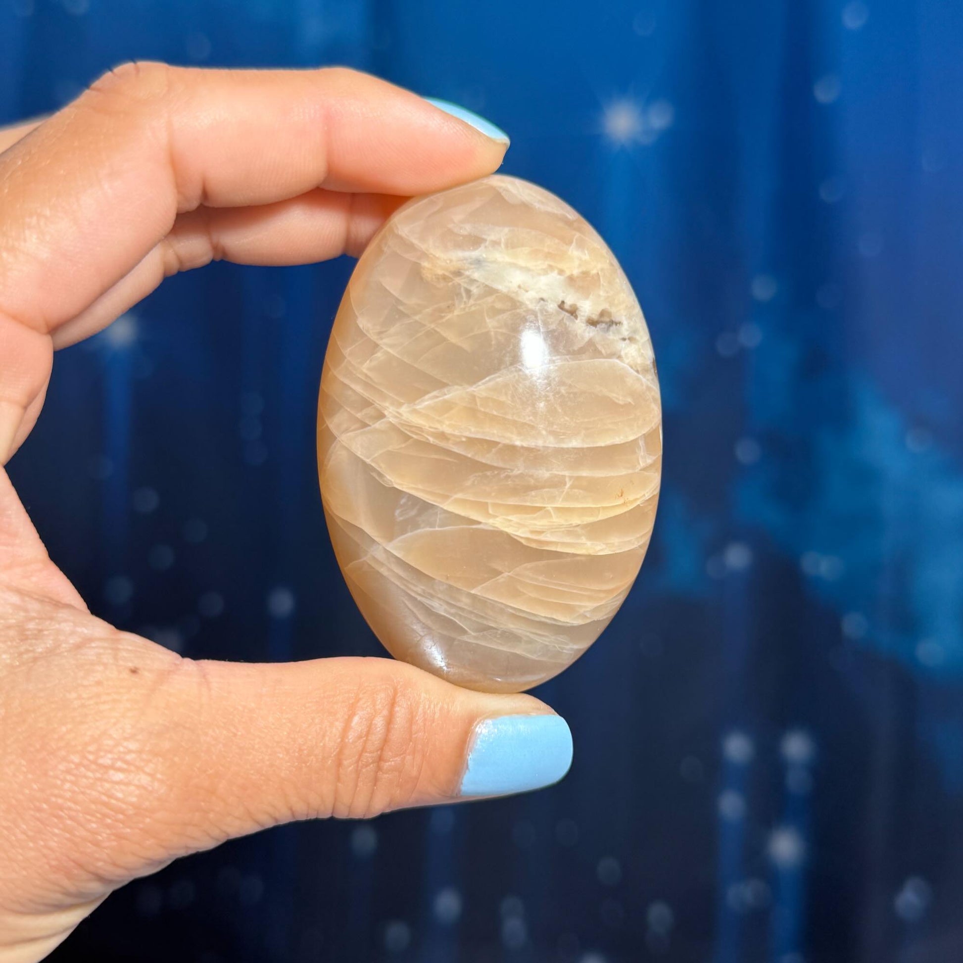 Flashy Peach Moonstone palm stone | 2 5/8" long | 113 grams | dual flash | Sunstone inclusion | Smoky Quartz inclusion