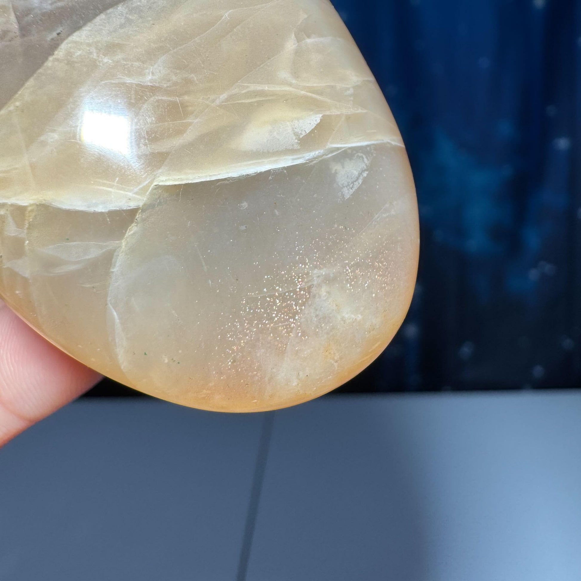 Flashy Peach Moonstone palm stone | 2 5/8" long | 113 grams | dual flash | Sunstone inclusion | Smoky Quartz inclusion