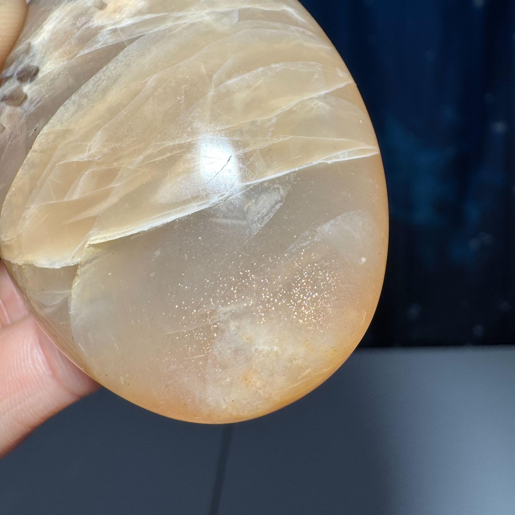Flashy Peach Moonstone palm stone | 2 5/8" long | 113 grams | dual flash | Sunstone inclusion | Smoky Quartz inclusion