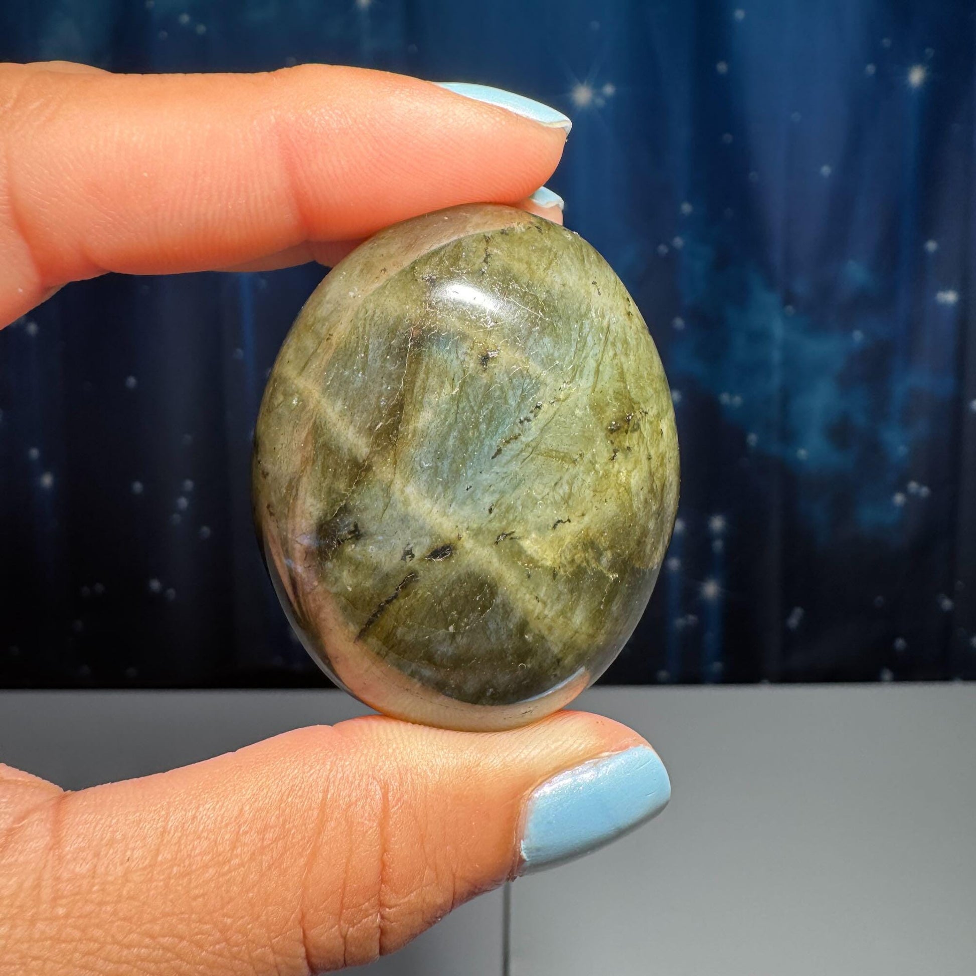 Labradorite palm stone | 1 7/8” long | 76 grams | blue flash | yellow flash | silver flash | orange flash
