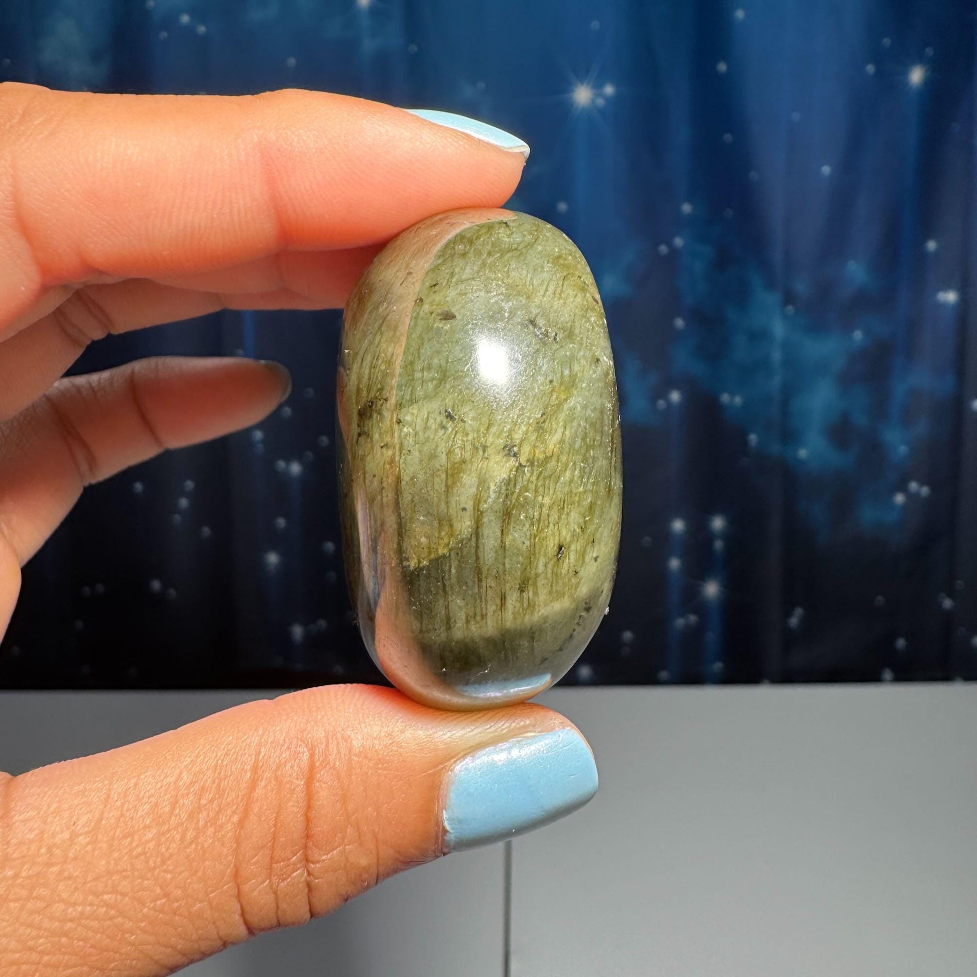 Labradorite palm stone | 1 7/8” long | 76 grams | blue flash | yellow flash | silver flash | orange flash