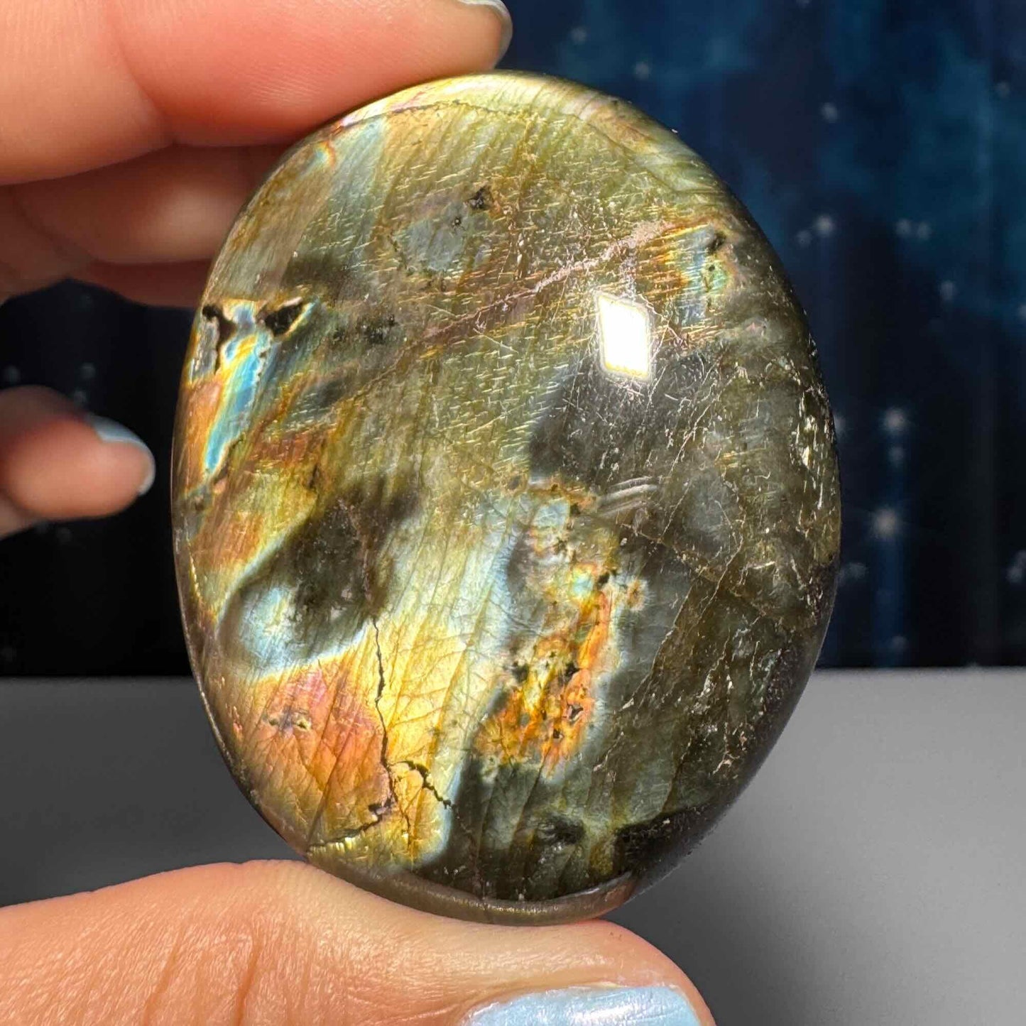 Flashy Labradorite palm stone | 2 1/8” long | 70 grams | silver flash | orange flash | blue flash | yellow flash | pink flash | purple flash