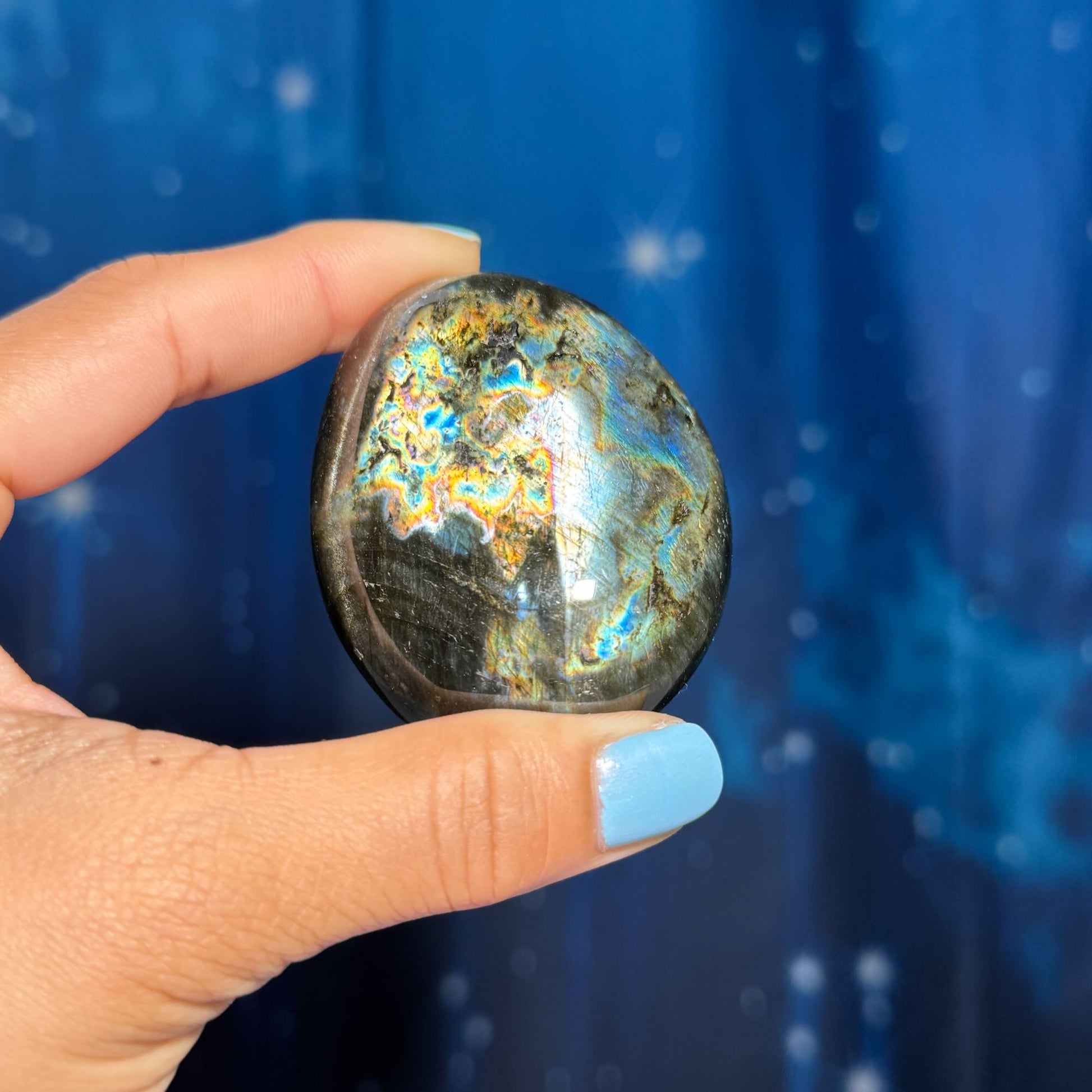 Flashy Labradorite palm stone | 2 1/2” long | 130 grams | silver flash | blue flash | orange flash | purple flash