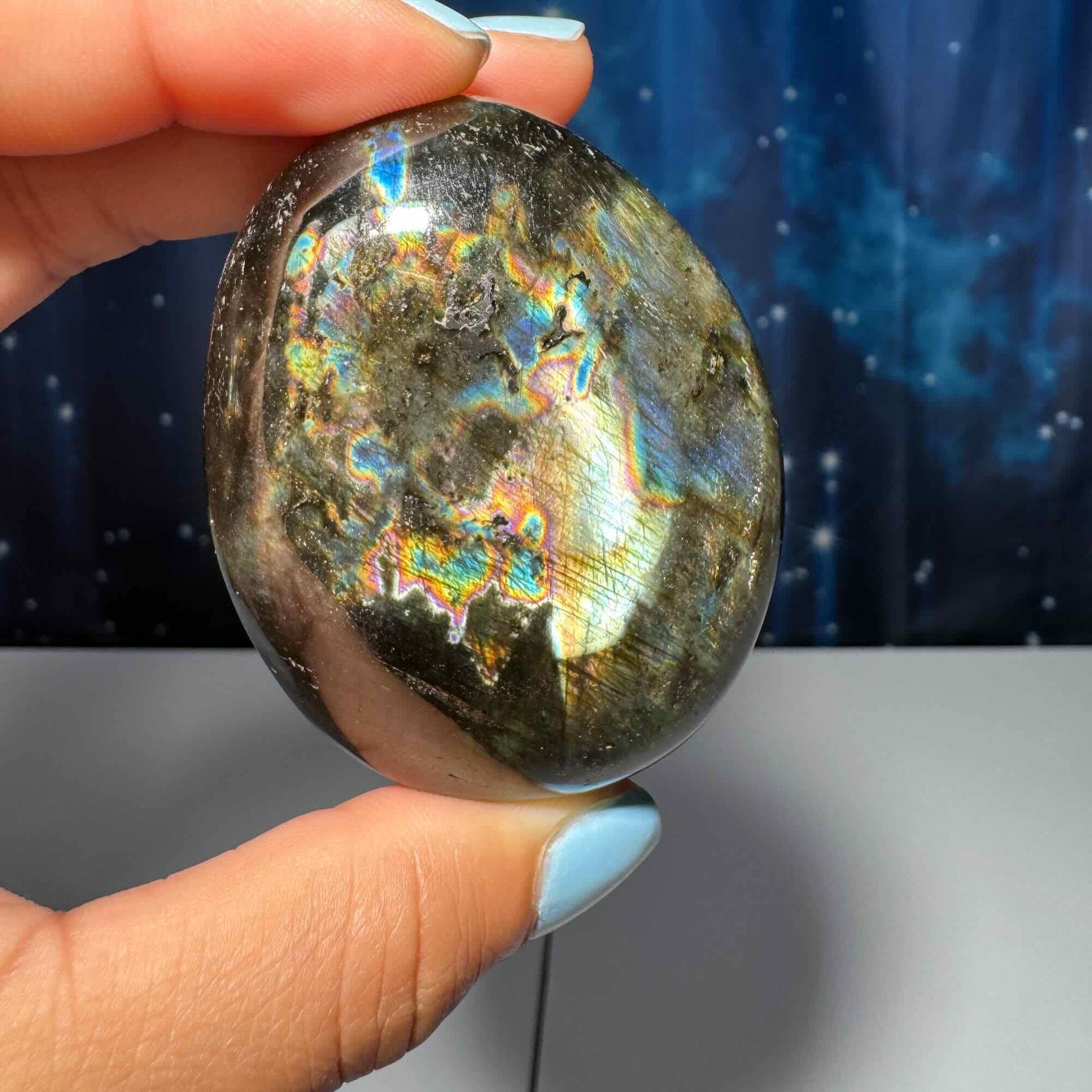 Flashy Labradorite palm stone | 2 1/2” long | 130 grams | silver flash | blue flash | orange flash | purple flash