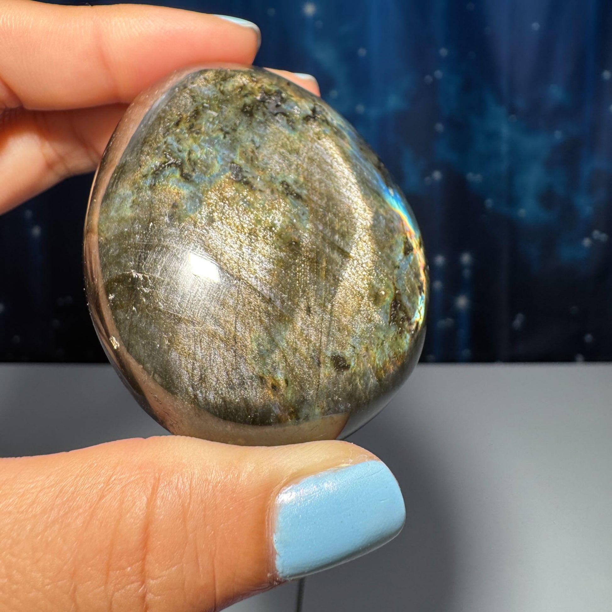 Flashy Labradorite palm stone | 2 1/2” long | 130 grams | silver flash | blue flash | orange flash | purple flash