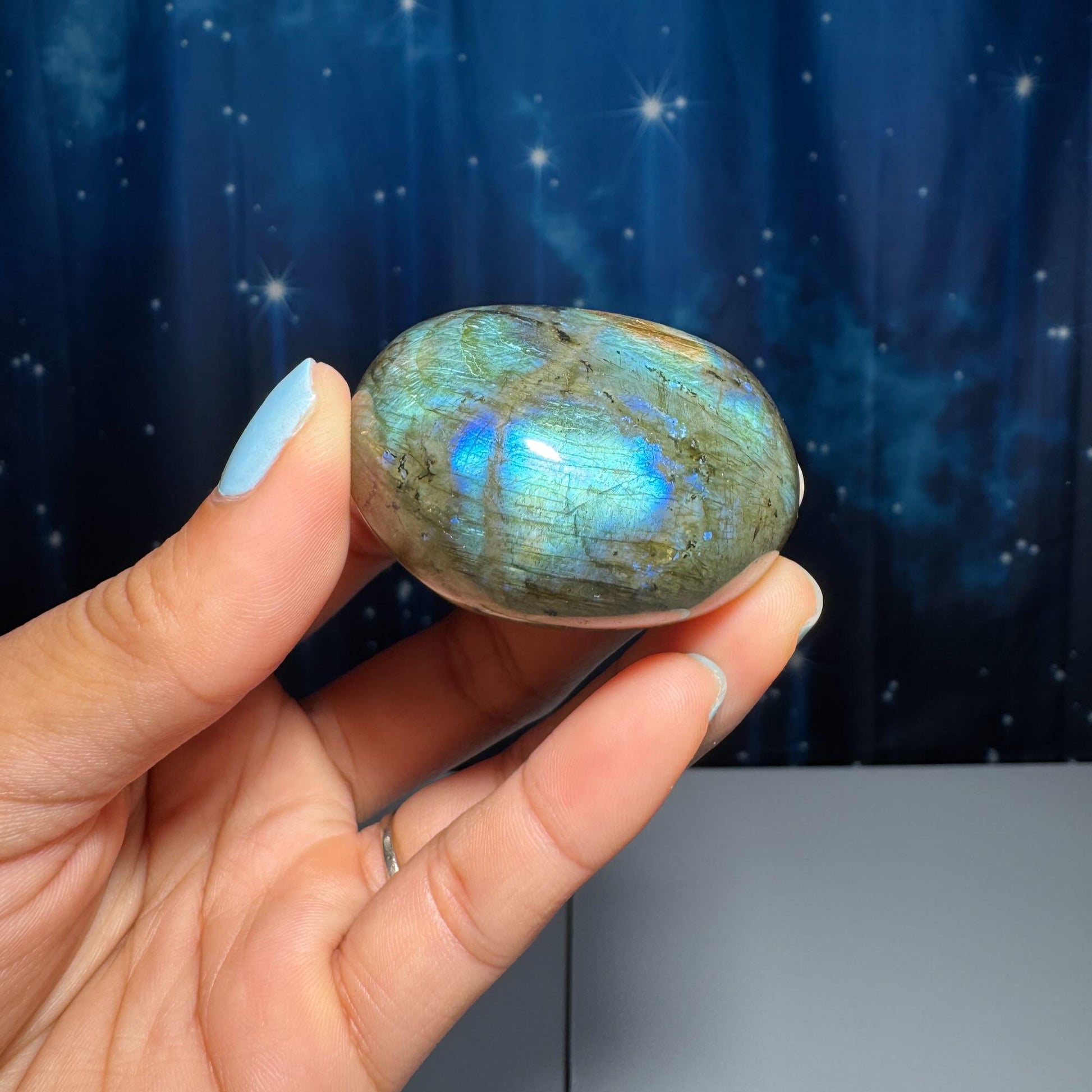 Labradorite palm stone | 1 7/8” long | 76 grams | blue flash | yellow flash | silver flash | orange flash