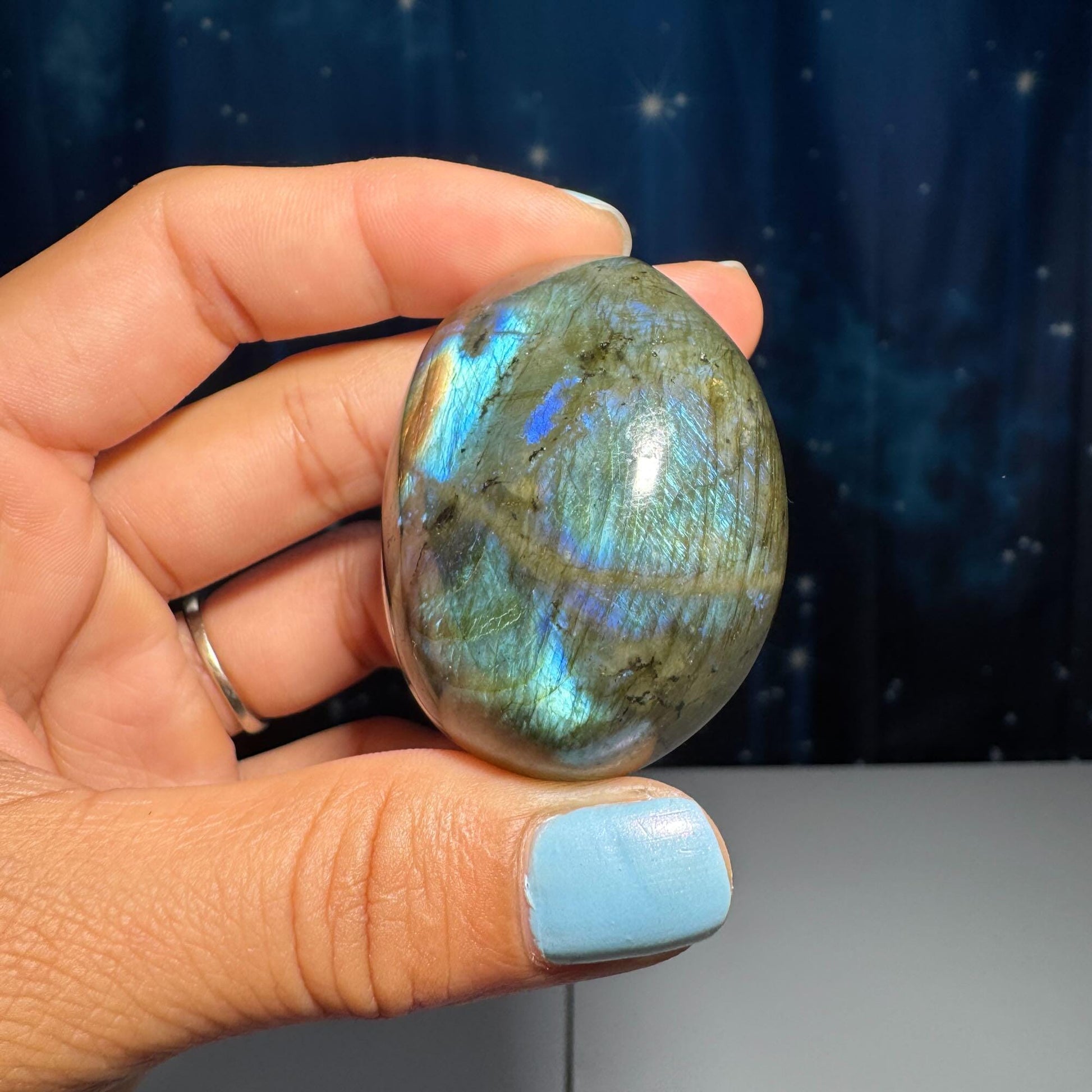 Labradorite palm stone | 1 7/8” long | 76 grams | blue flash | yellow flash | silver flash | orange flash