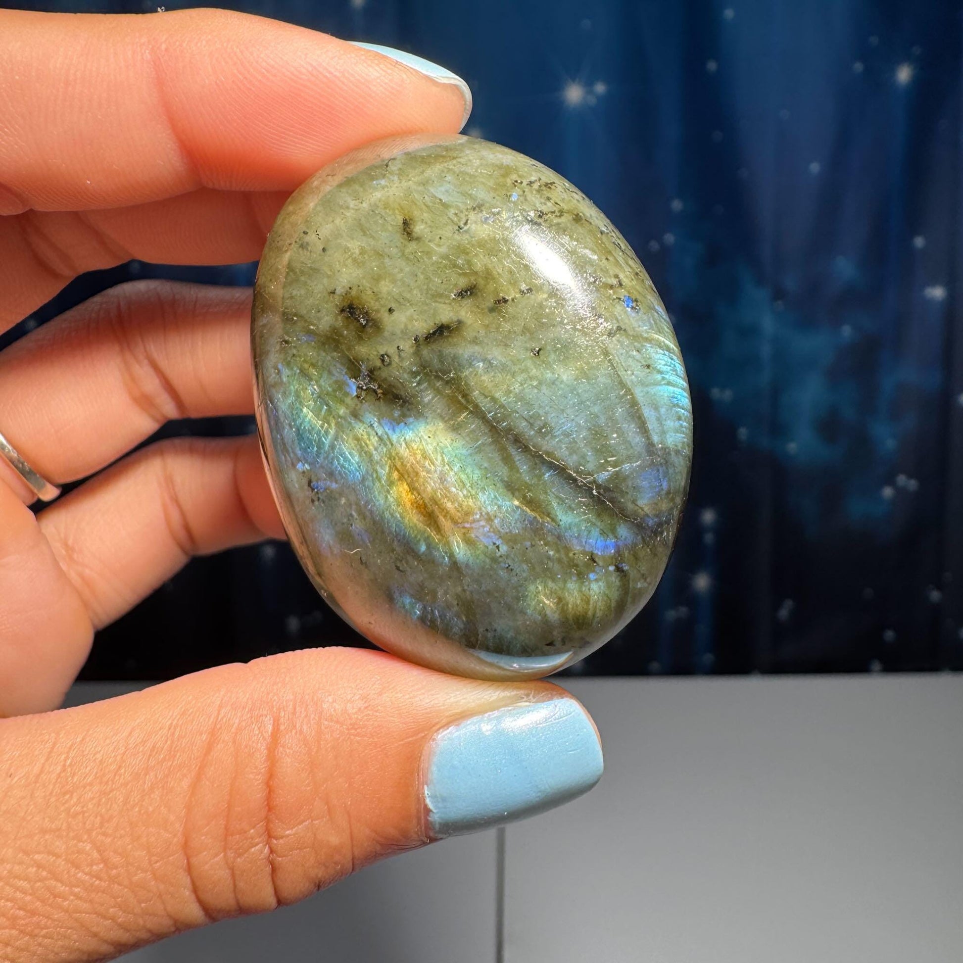 Labradorite palm stone | 1 7/8” long | 76 grams | blue flash | yellow flash | silver flash | orange flash