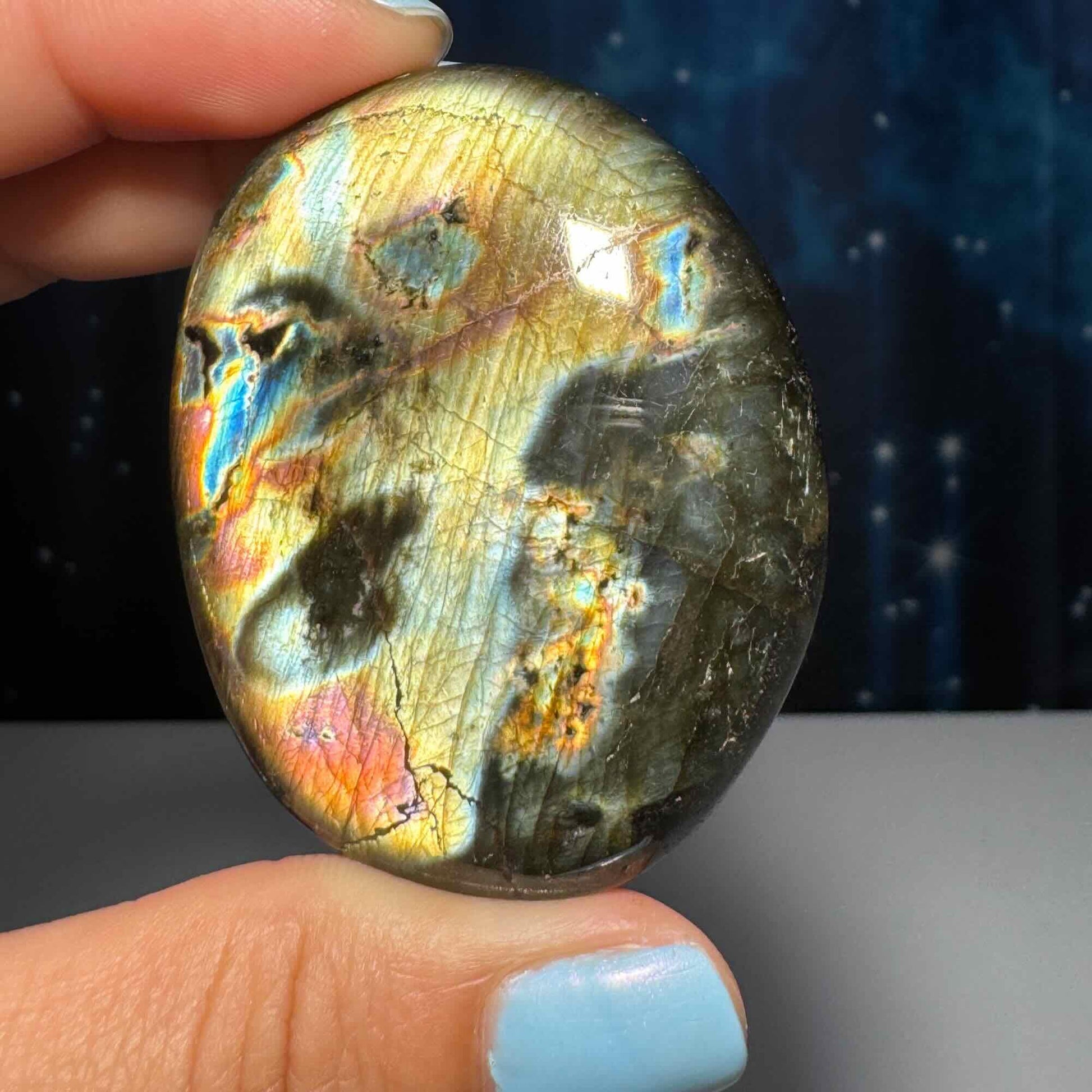 Flashy Labradorite palm stone | 2 1/8” long | 70 grams | silver flash | orange flash | blue flash | yellow flash | pink flash | purple flash