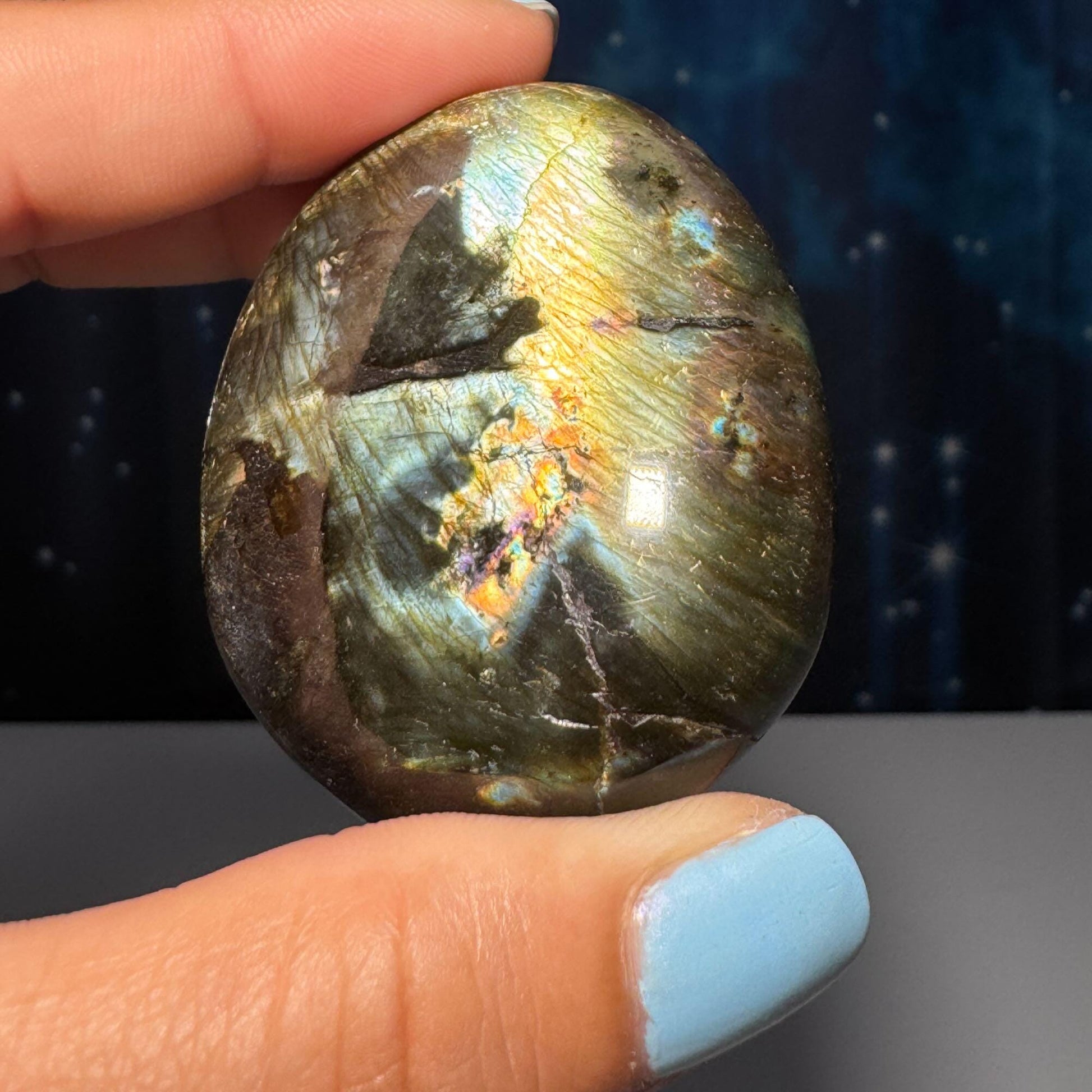 Flashy Labradorite palm stone | 2 1/8” long | 70 grams | silver flash | orange flash | blue flash | yellow flash | pink flash | purple flash