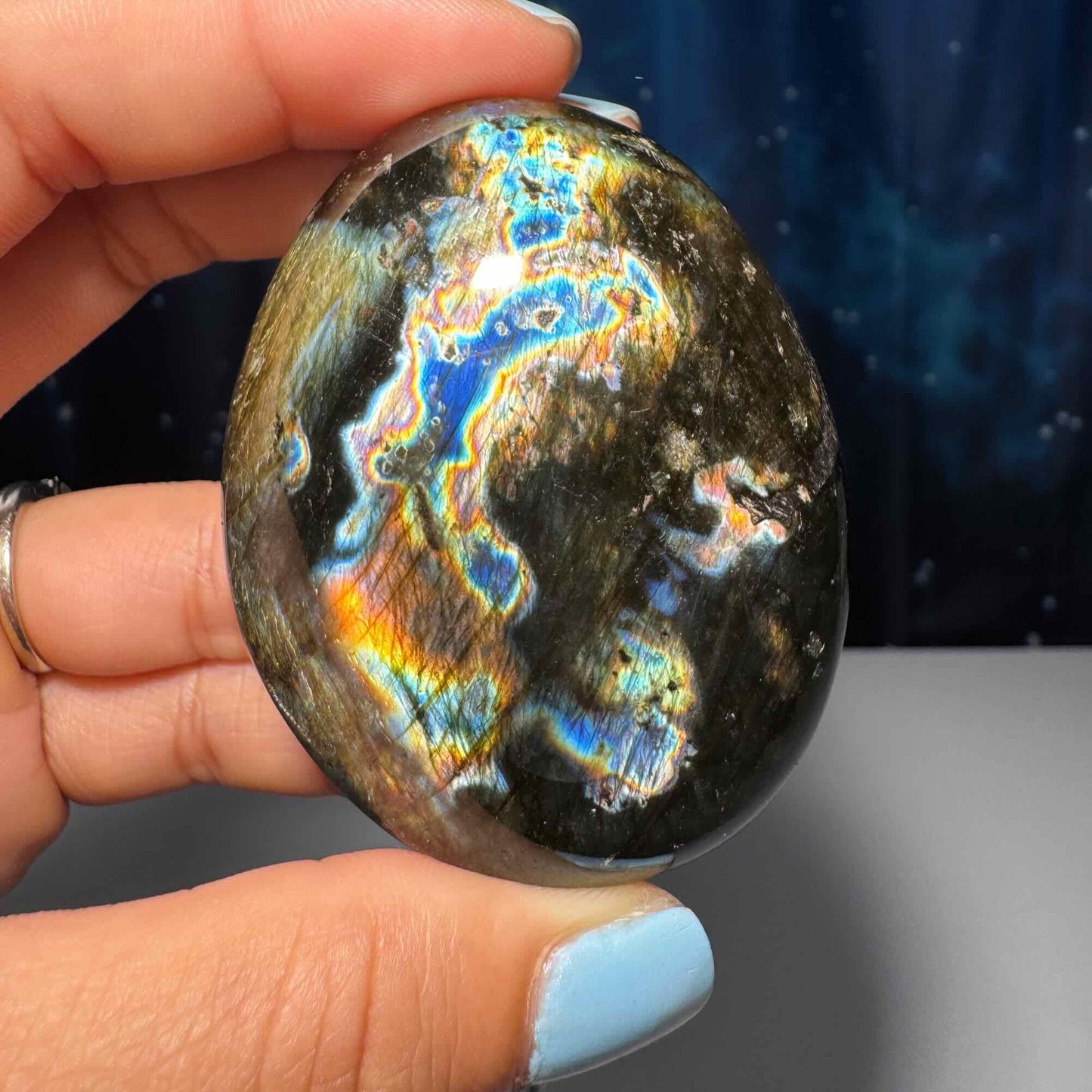 Flashy Labradorite palm stone | 2 1/2” long | 130 grams | silver flash | blue flash | orange flash | purple flash