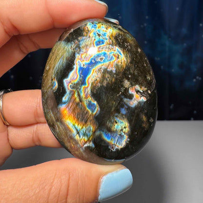 Flashy Labradorite palm stone | 2 1/2” long | 130 grams | silver flash | blue flash | orange flash | purple flash