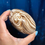 Brown Aragonite goddess egg | 3 3/4" long | 465 grams | gorgeous banding | Tucson find | pill shape | ellipsoid